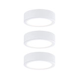 Three round white LED ceiling lights made of plastic with warm white light for modern interiors