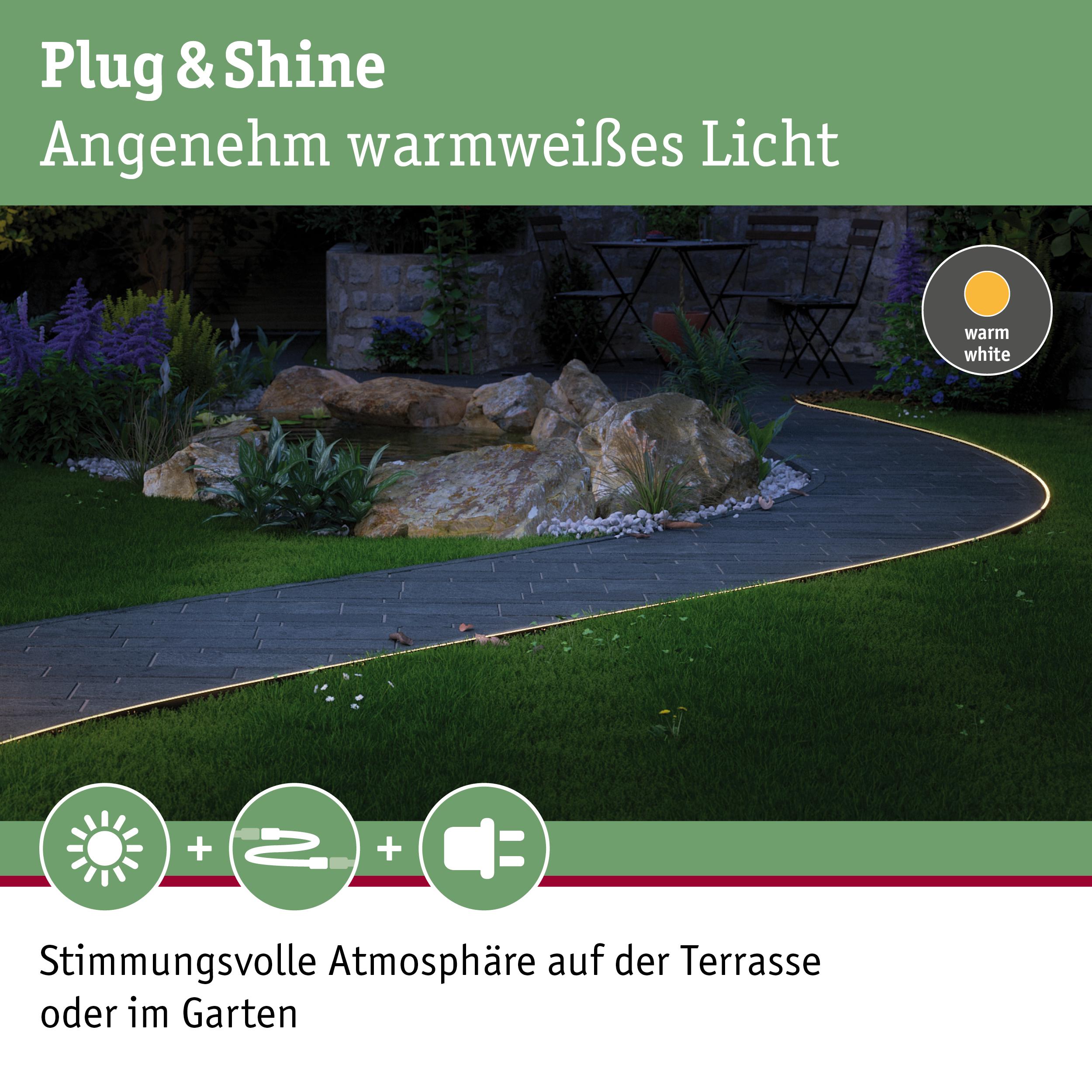 Warmweißes LED-Licht entlang eines Gartenwegs aus Stein für stimmungsvolle Terrasse und Gartenbeleuchtung