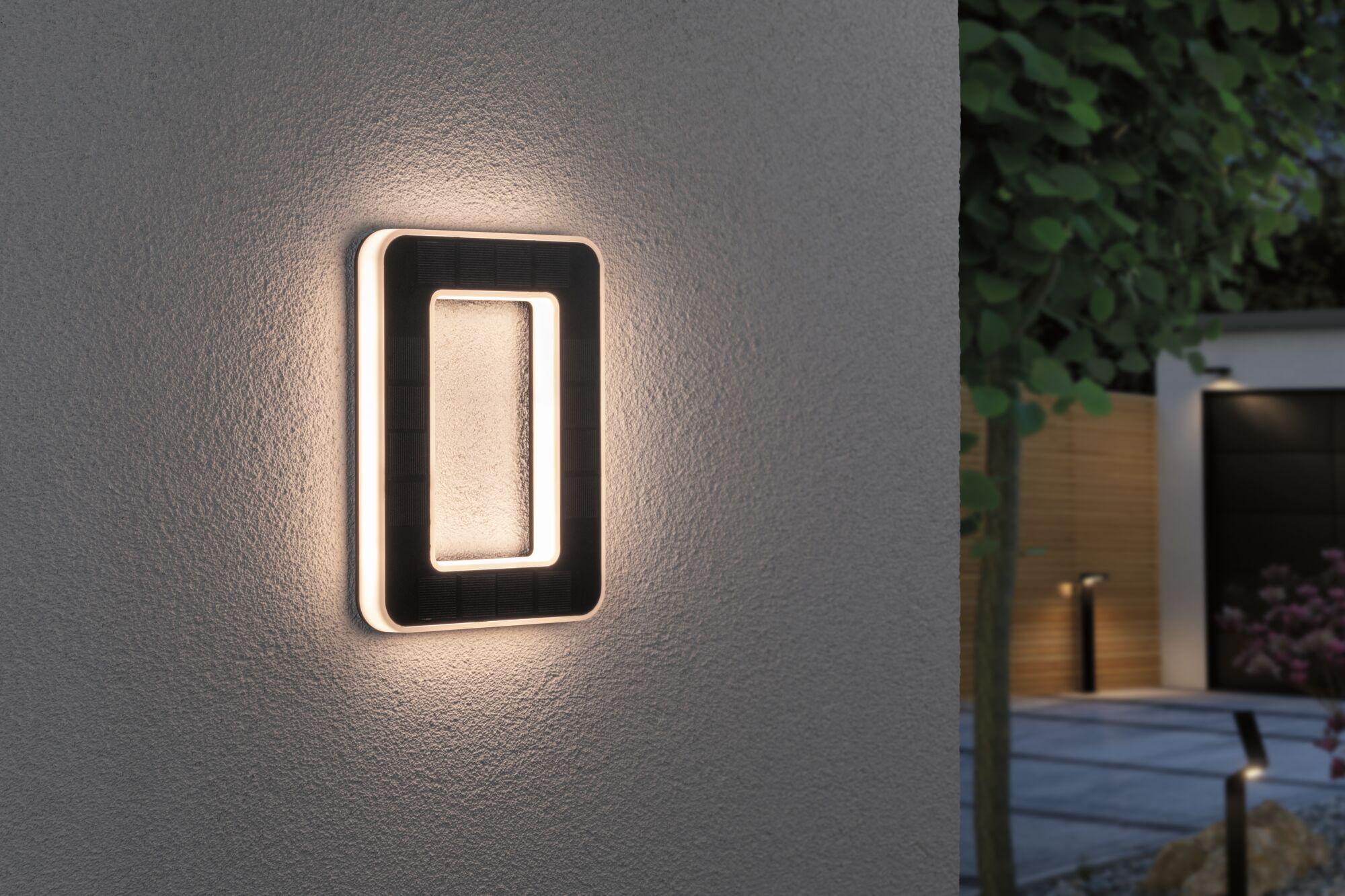 Modern black rectangular LED wall light with warm white illumination for outdoor use