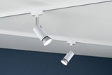 Deux spots LED métalliques blancs fixés sur rail blanc pour éclairage moderne