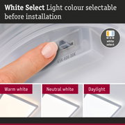 Finger adjusting white light colour before installation showing warm, neutral and daylight LED options