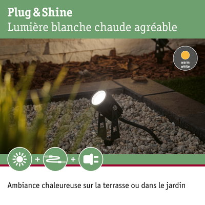 Projecteur extérieur noir Plug & Shine avec lumière blanc chaud sur gravier pour éclairage jardin