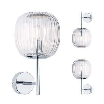 Wall light with ribbed clear glass and chrome metal, modern indoor lighting fixture design.