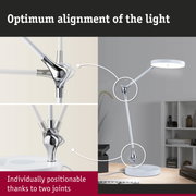 White LED desk lamp with chrome joints for flexible light positioning in office settings