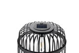 Black solar lamp with metal cage and visible LED bulb for outdoor lighting solutions.