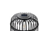 Lampe solaire noire avec cage en métal et ampoule LED visible pour éclairage extérieur.