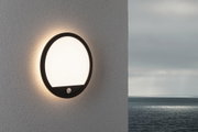 Round black outdoor wall light with white diffuser and motion sensor, weatherproof for garden and terrace