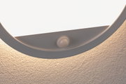 Round white ceiling light with built-in motion sensor for energy-efficient lighting