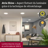Luminaires LED Atria Shine avec lumière blanche chaude 3000K et rétroéclairage dans un salon moderne.