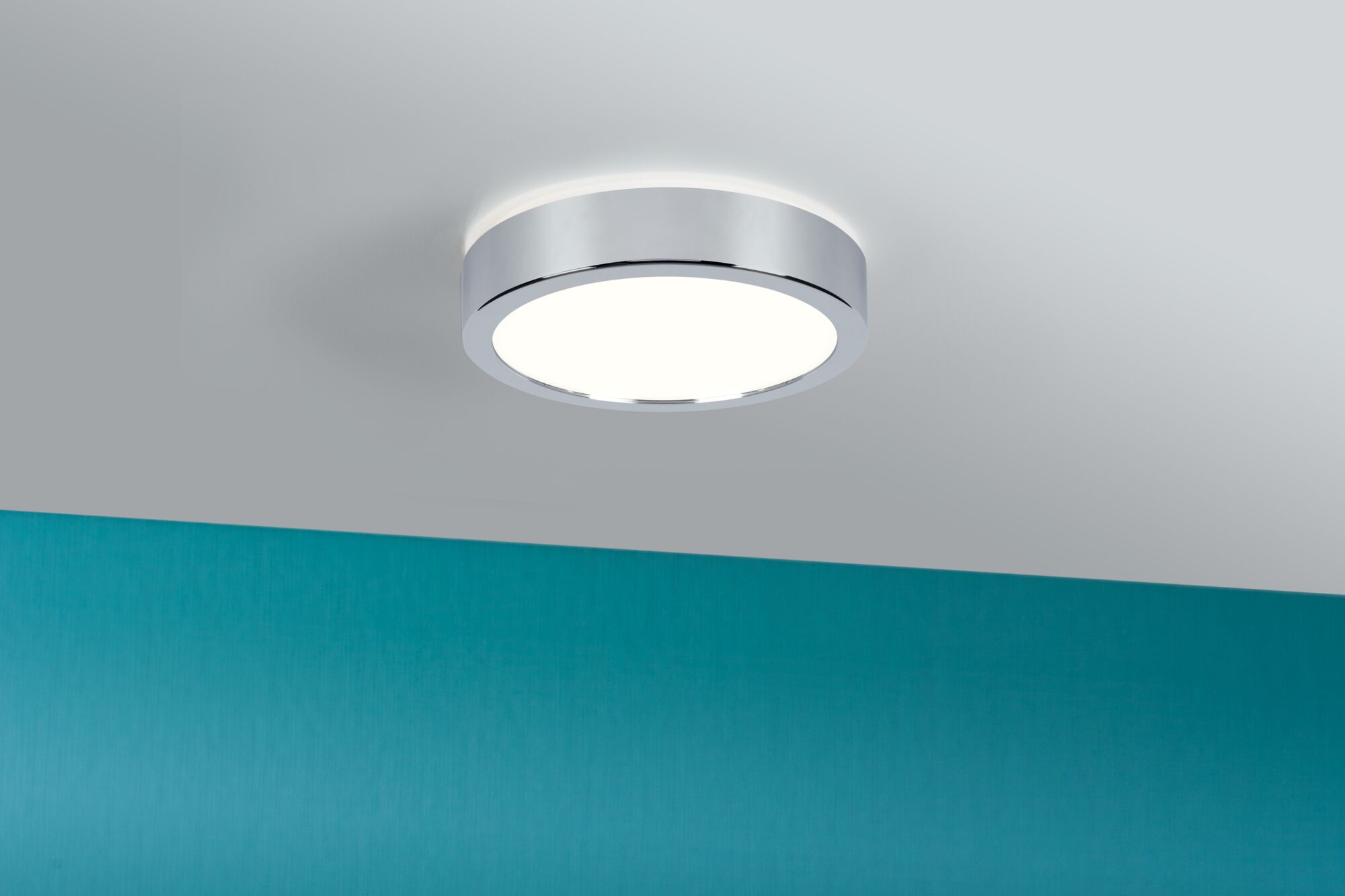 Round ceiling light with chrome metal frame and white diffuser for modern interior lighting