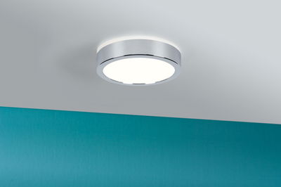 Round ceiling light with chrome metal frame and white diffuser for modern interior lighting