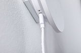 Close-up of white cable connection on white wall mount for electronic device installation