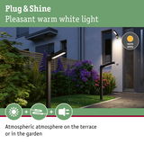 Modern black LED outdoor lights with warm white light creating atmospheric terrace and garden illumination