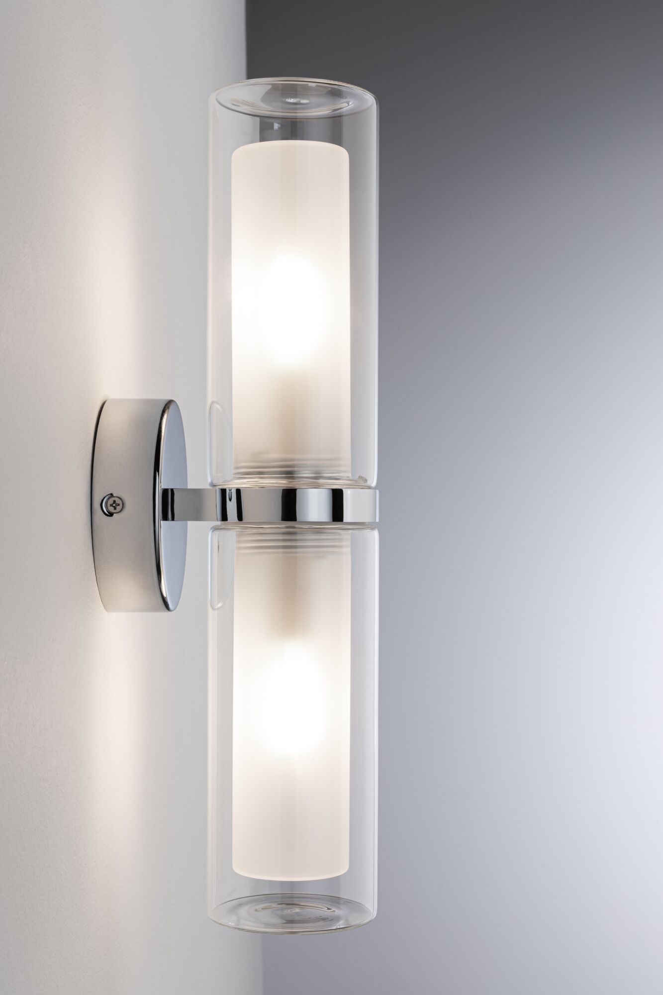 Modern wall light with double glass cylinder and chrome metal mount for stylish indoor lighting