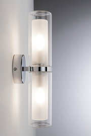 Modern wall light with double glass cylinder and chrome metal mount for stylish indoor lighting