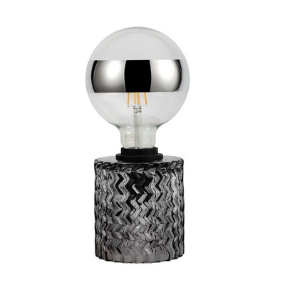 Moderne tafellamp met zilveren lamp en gestructureerde grijze glazen voet voor sfeerverlichting