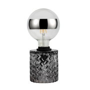 Light bulb with silver mirror cap and clear glass base on black textured holder for lighting decor