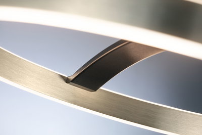 Close-up of modern LED ceiling light in brushed aluminium with black connector detail