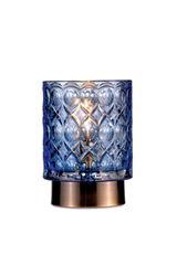 Table lamp with blue patterned glass and bronze metal base for ambient lighting in living spaces