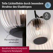 Wandleuchte mit geriffeltem klarem Glas und schwarzer Metallplatte für blendfreie Beleuchtung