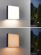 Square outdoor wall light with black frame emitting warm and cool white light for garden lighting