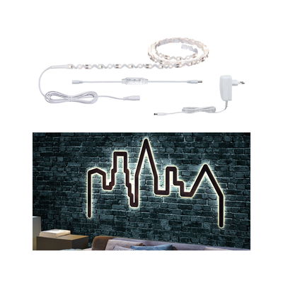 LED strip light with white cable and remote, illuminating skyline wall decoration with warm white light
