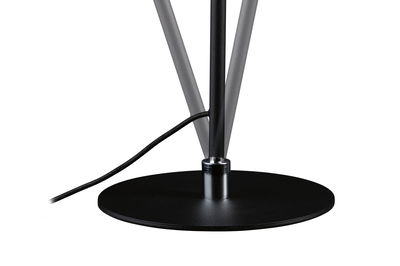 Black round metal base with cable connection for modern LED floor lamp in minimalist style