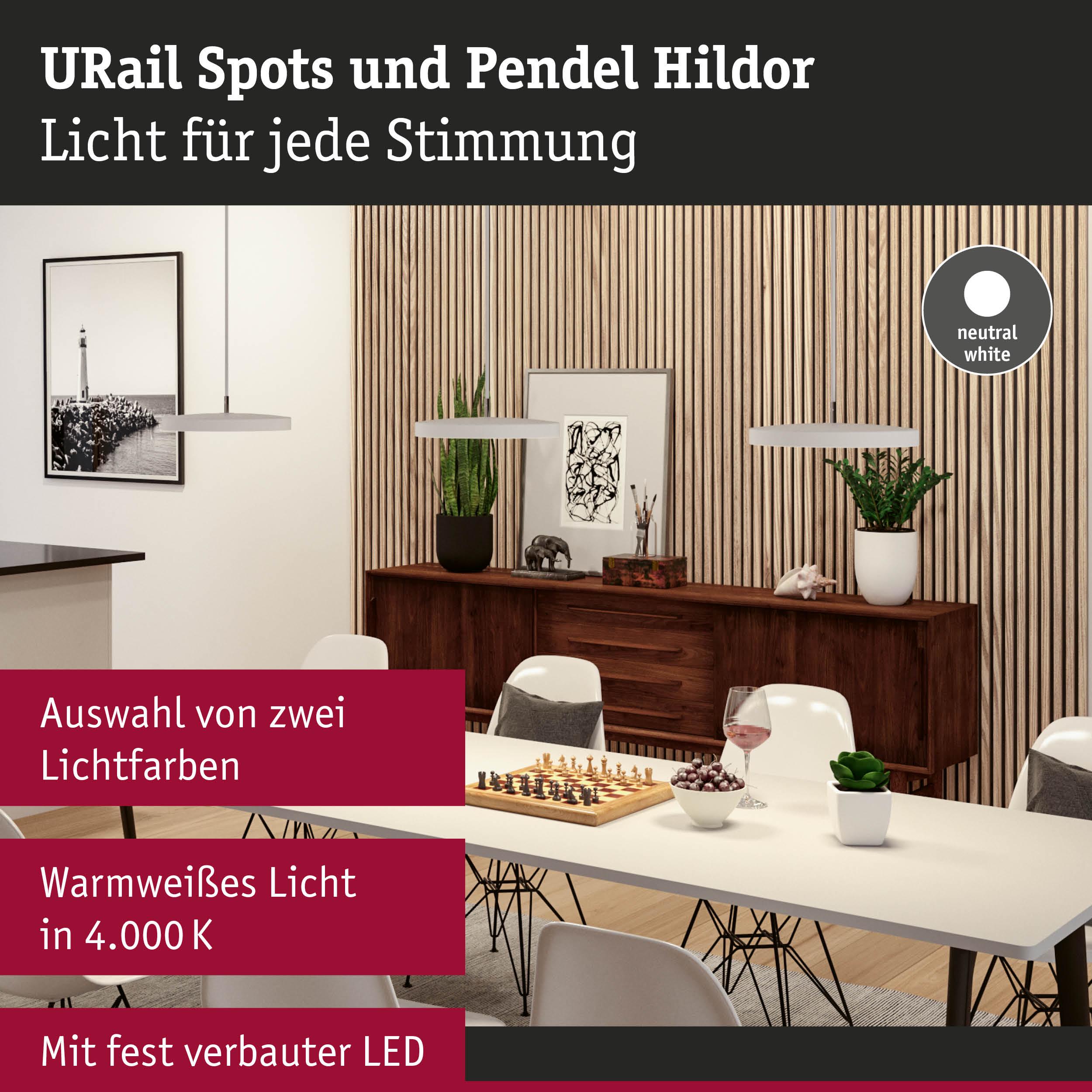 Moderne Pendelleuchten Hildor in Weiß mit fest verbauter LED über Esstisch mit Schachspiel und Pflanzen