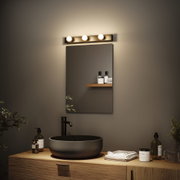 Modernes Badezimmer mit schwarzem Keramik-Waschbecken, Holzunterschrank und warmweißer LED-Spiegelleuchte