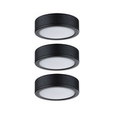 Three round black LED ceiling lights with white diffuser for modern indoor lighting