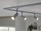 Three silver LED track spotlights on white ceiling for modern home lighting.