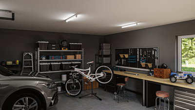Modern workshop with LED ceiling lights, bike on stand, tool wall, and workbench with storage units.