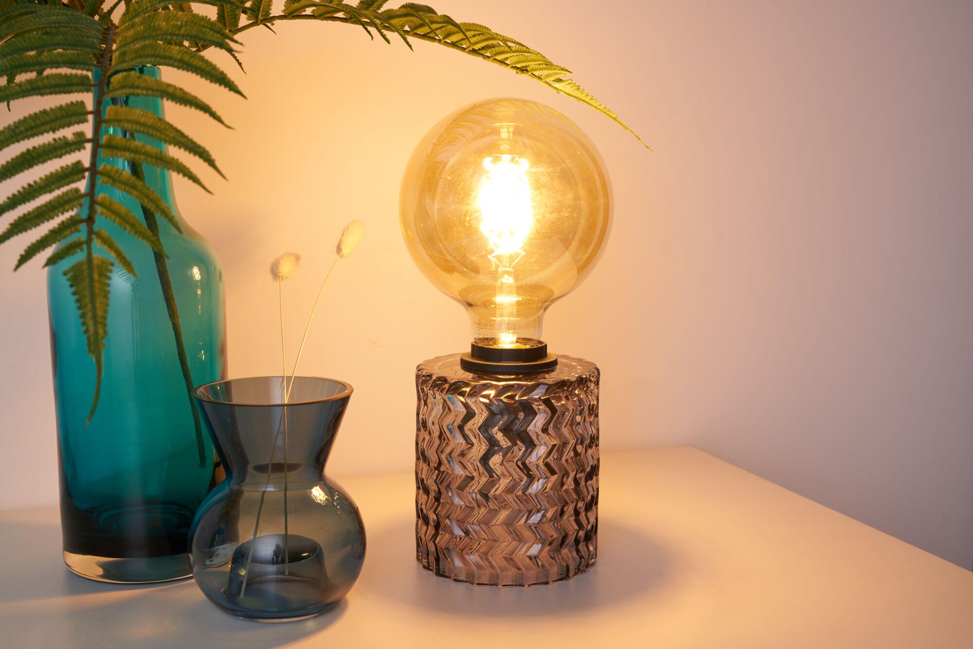 Glass table lamp with warm white LED bulb and blue decorative vase for ambient lighting