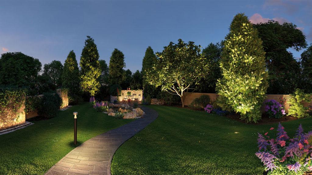 Beleuchteter Gartenweg mit LED-Außenleuchten und angestrahlten Bäumen für stimmungsvolle Gartengestaltung.