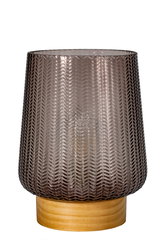 Patterned smoky grey glass candle holder on light wooden base, decorative home accessory