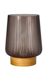 Brown patterned glass lantern on light wooden base for decorative home lighting
