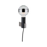 Modern wall lamp with black metal holder and clear bulb featuring silver band, visible cable included