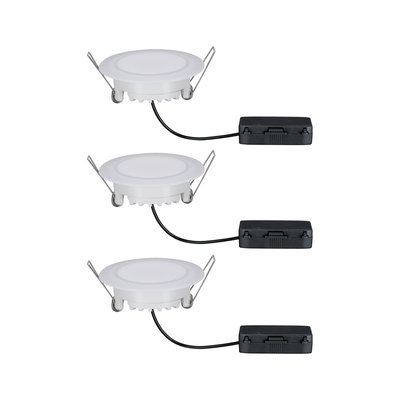 Three white plastic LED recessed spotlights with metal clips and black connection boxes for indoor lighting