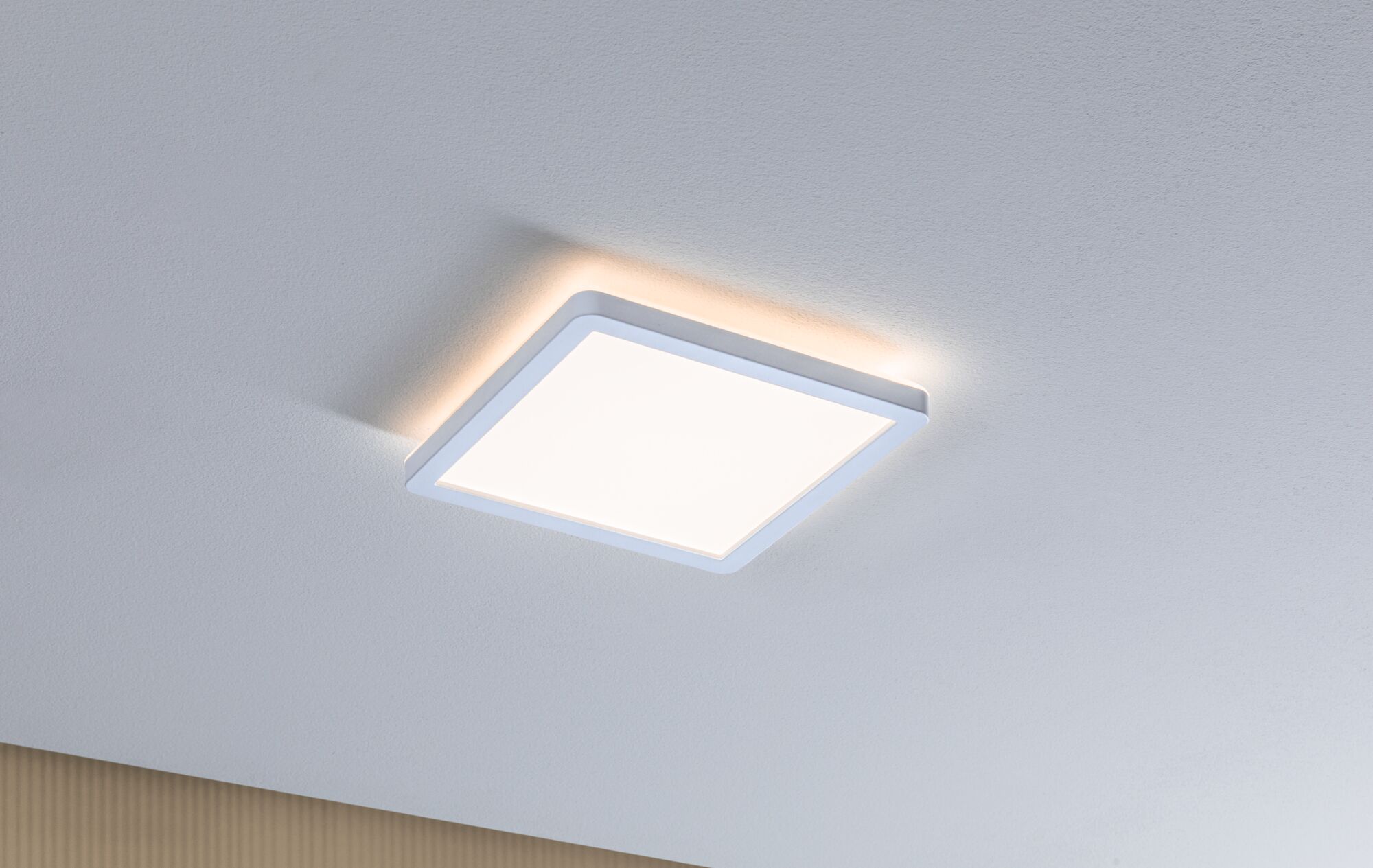 Square white LED ceiling light with indirect glow for modern interior lighting