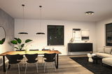 Modern dining room with black Paulmann LED pendant lights and wooden table in warm lighting.