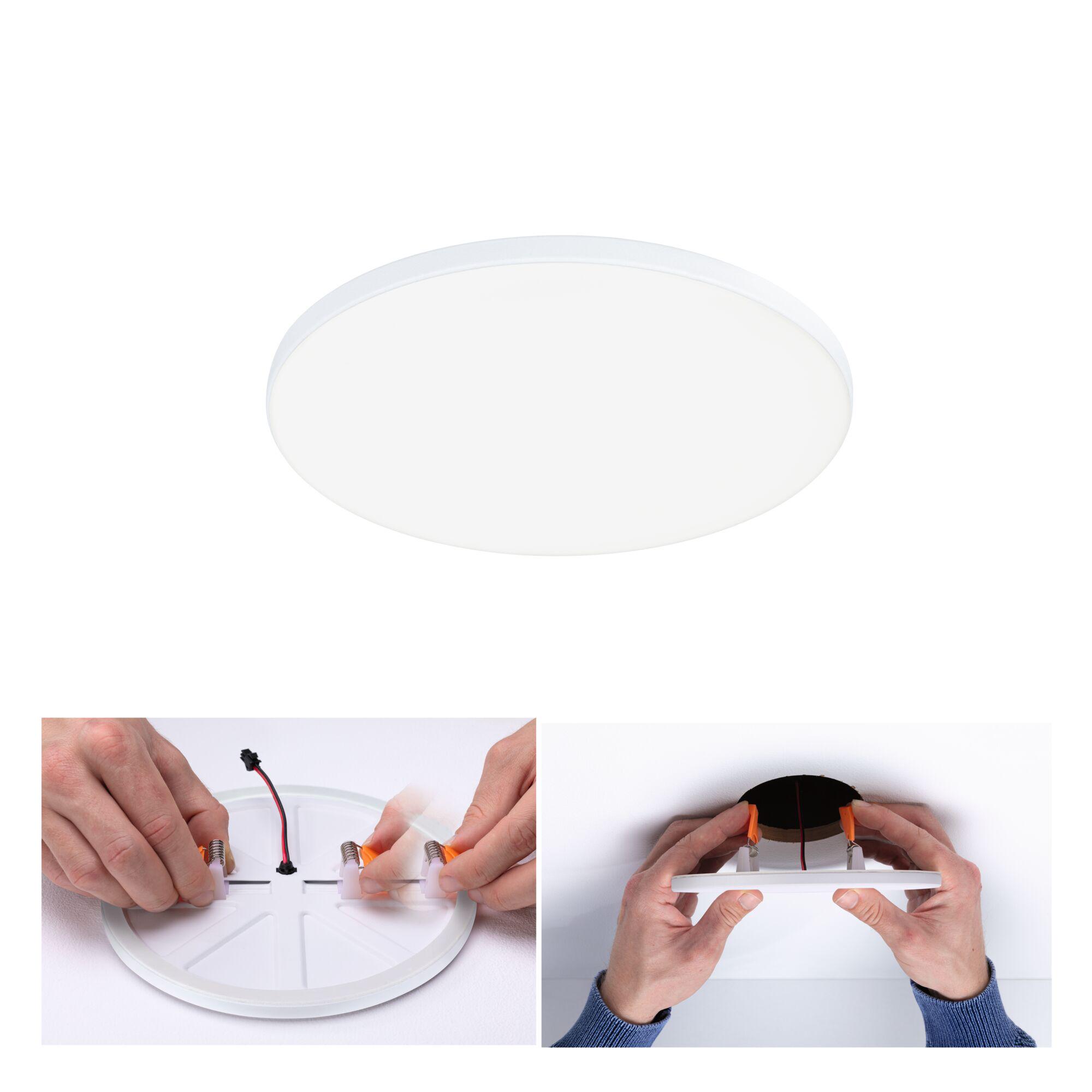 Round white plastic LED ceiling light with mounting clips and electrical wiring for home lighting