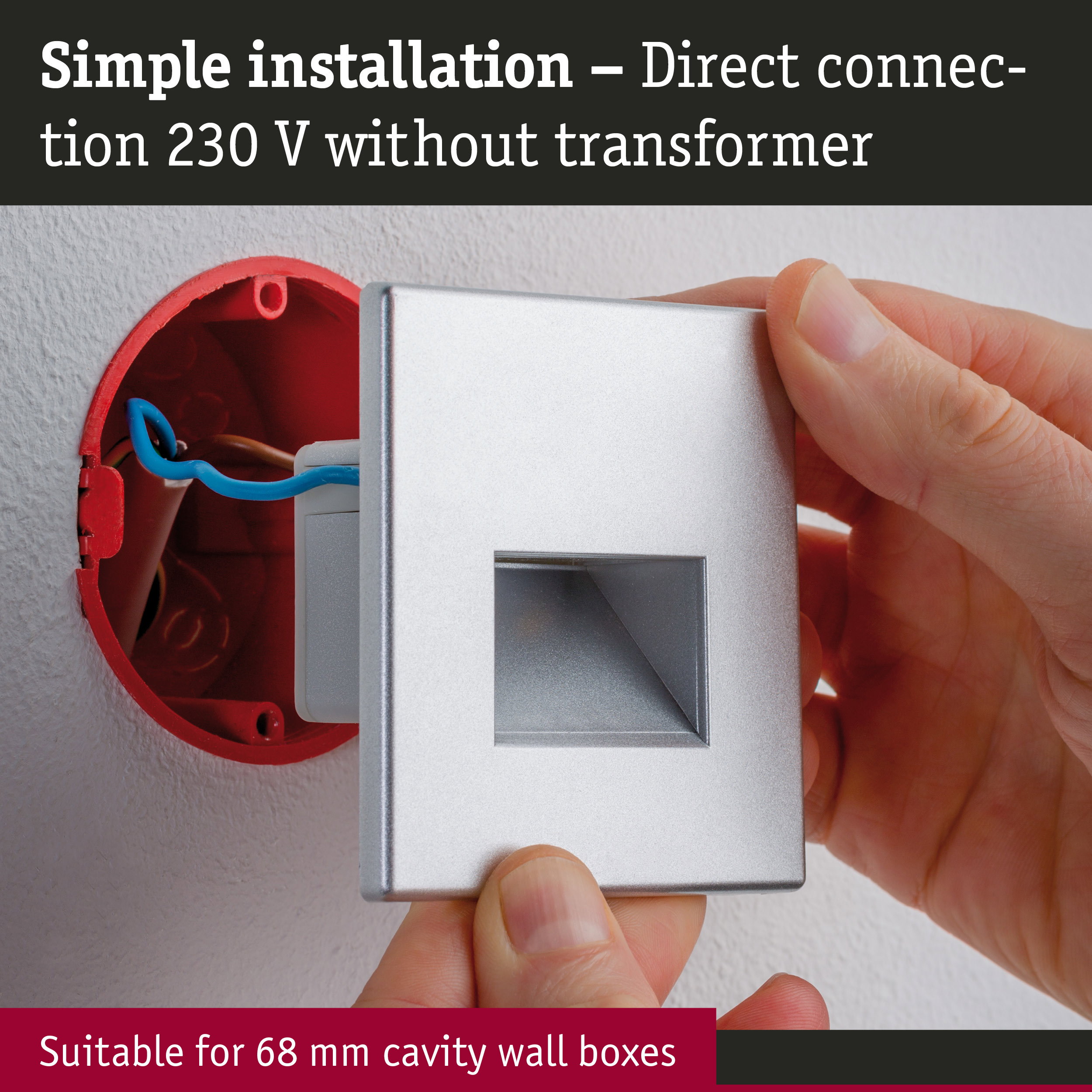 Hand installing silver wall connector with direct 230 V connection without transformer for cavity wall boxes.