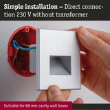 Hand installing silver wall connector with direct 230 V connection without transformer for cavity wall boxes.