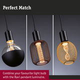 Three modern pendant lights with black and gold metal mesh shades and different light bulbs.