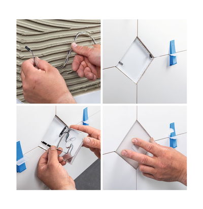 Installation of white ceramic LED tile with cable connection on wall tiles using spacers.