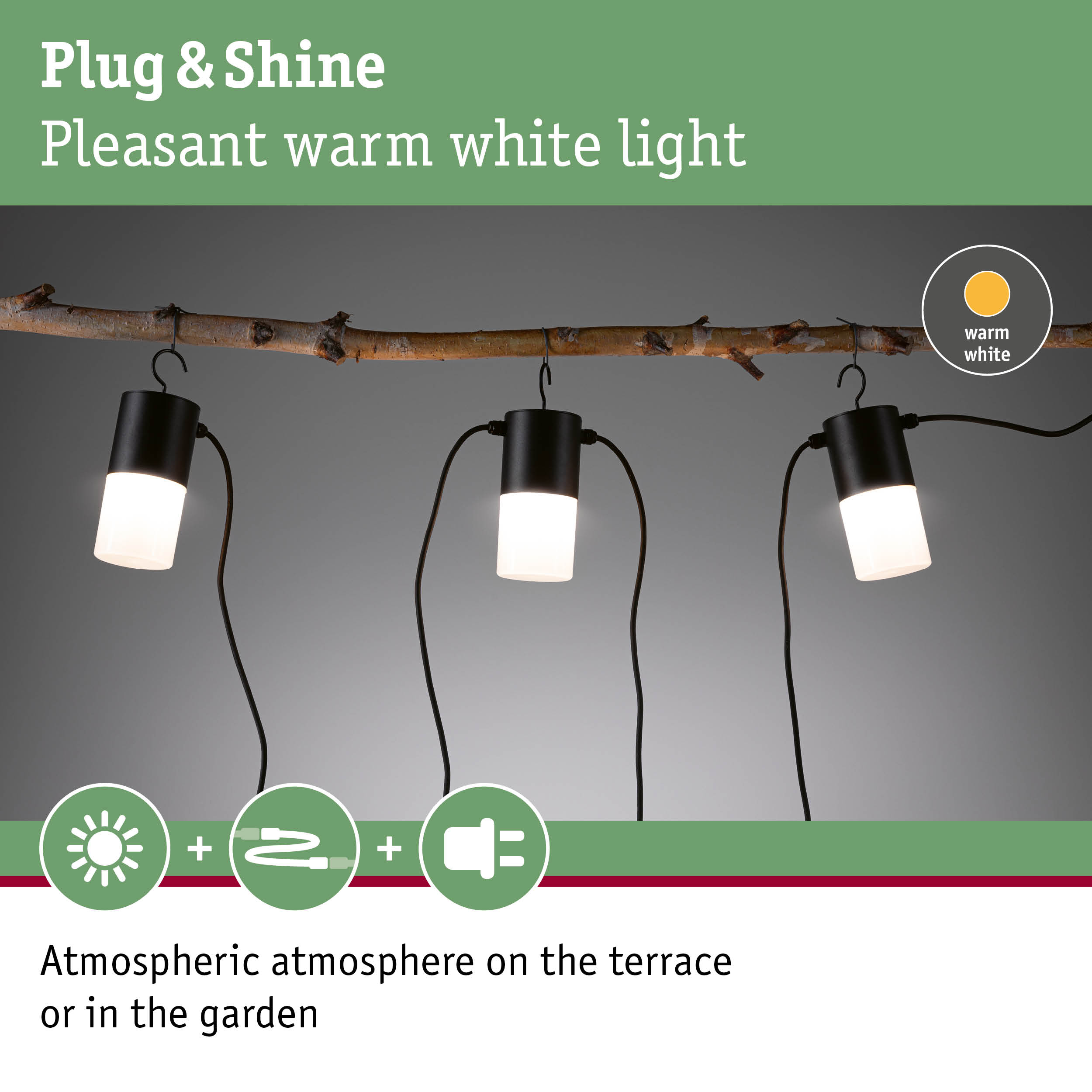 Black outdoor lights with warm white light hanging on natural branch for garden and terrace lighting