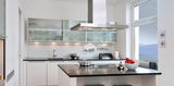 Modern white kitchen with black countertop and stainless steel extractor hood, kitchen lighting included