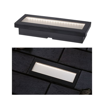 Black metal LED recessed floor light with rectangular design and warm white illumination for outdoor use