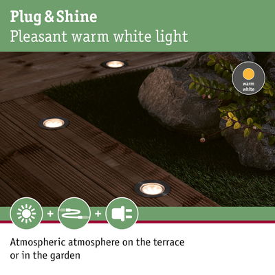 Warm white Plug & Shine LED recessed lights in wooden terrace creating atmospheric garden lighting