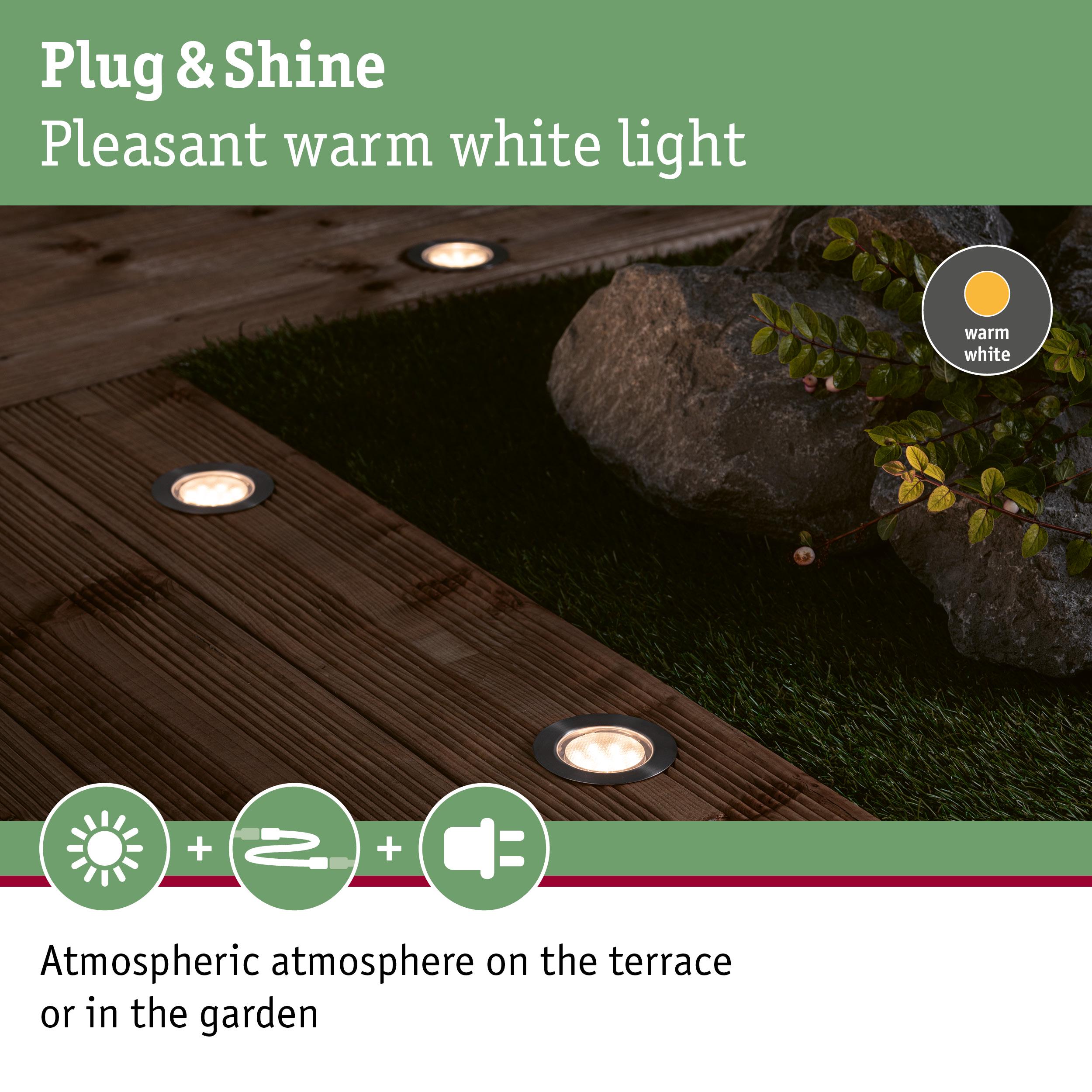Warm white Plug & Shine LED recessed lights in wooden terrace creating atmospheric garden lighting